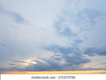 Sunset sky clouds background. Beautiful landscape with clouds and orange sun on sky