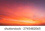 Sunset Sky Clouds Background in the evening with Red, Orange, Yellow and purple sunlight on Golden hour after sundown, Romantic sky in summer on Dusk Twilight 