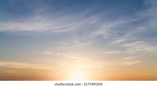 Sunset Sky clouds Background with Romantic Orange, Yellow Morning Sunrise, Golden Hour in the Summer Evening Sky