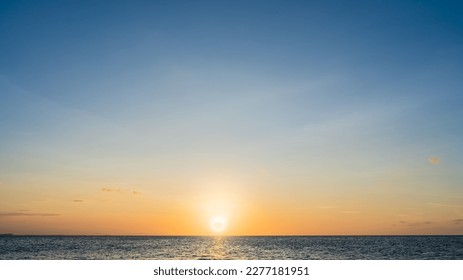 Sunset Sky Clouds Backgrounds in the Evening with Golden hour sunlight, Dusk sky Dark Blue Background on Landscape Horizon Sea and Sundown in Summer  - Powered by Shutterstock
