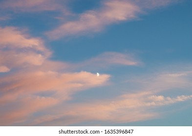 Sunset sky, clouds and moon.