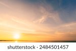 Sunset, Sky clouds over sea in the Evening with Orange, Yellow Gold sunlight in Golden hour and Dramatic fluffy, Horizon sea Summer sky landscape, Dusk sky background