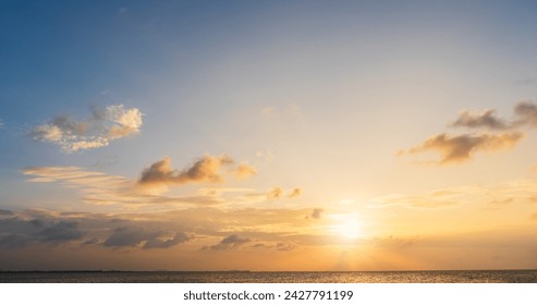 Sunset sky clouds over sea in the evening with Orange sunlight Golden hour, Landscape horizon sea sky, Dusk sky nature background  - Powered by Shutterstock