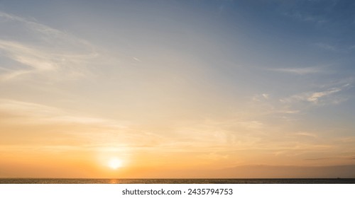 Sunset Sky Clouds over Sea in the Evening with Orange sunlight, Horizon Sea Sky Landscape Background and Sun down in Golden Hour Summer Season, Dusk Sky - Powered by Shutterstock