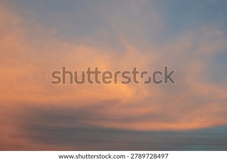 Sunset Sky with Clouds and Power Lines
