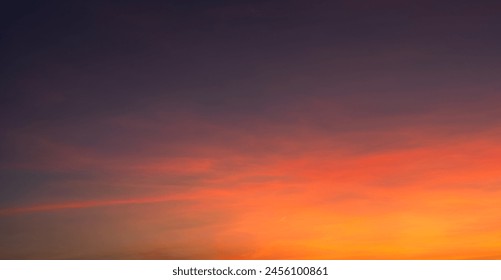 Sunset sky clouds in the veining with Red, Orange, Yellow and Purple dark blue after sundown, Romantic sky in Summer on Dusk twilight Background 