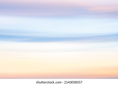 Sunset sky colors background in soft shades pink,blue and yellow.