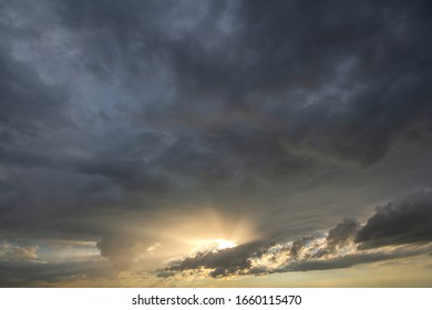 Sunset sky covered with dramatic storm puffy clouds before rain. - Powered by Shutterstock - Get 15% off with code: PIKWIZARD15
