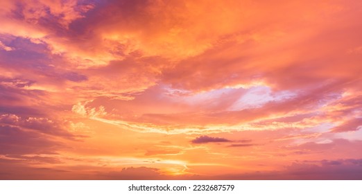 Sunset Sky in the Evening with Orange, yellow sunlight on Golden hour sky, Dramatic storm Clouds background  - Shutterstock ID 2232687579