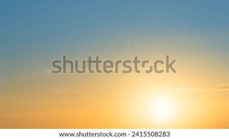Sunset sky, Golden hour in the evening with Orange, Yellow bright sunlight on blue sky background, Horizon nature sky majestic sunshine with sun down well space picturesque sunny warm light gold color