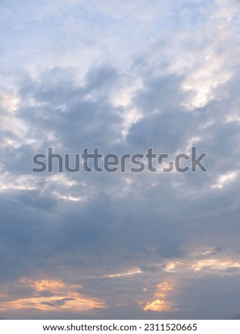 Sunset and sky, orange and gray clouds