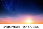 Sunset sky with orange setting sun and red clouds landscape against bright star on black universe background. Wide panorama view of stars in space nature at dark time. Starry night at night wallpaper