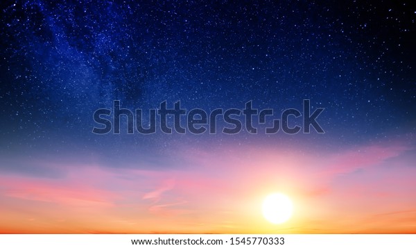 Sunset sky with orange setting sun and red
clouds landscape against bright star on black universe background.
Wide panorama view of stars in space nature at dark time. Starry
night at night wallpaper