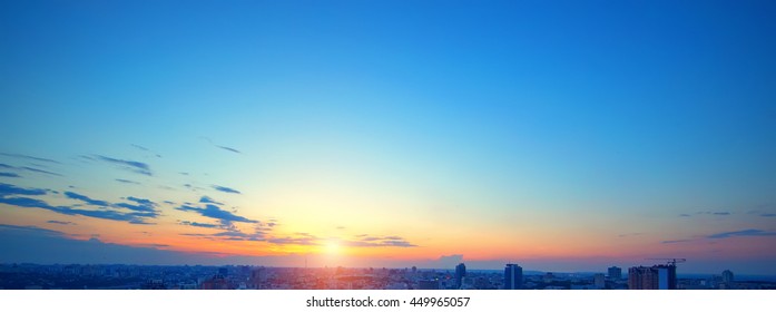 Sunset sky over a city. - Powered by Shutterstock