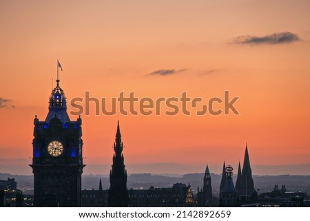 Sunset sky over Edinburgh with the city's towers and rooftops. Blue Hour, Balmoral Clocktower, Edinburgh, Scotland, United Kingdom 