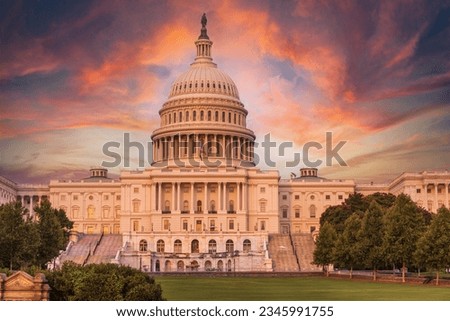Sunset sky over the US Capitol building dome in Washington DC.