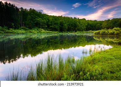 Sunset sky reflecting in a pond at Delaware Water Gap National Recreational Area, New Jersey.