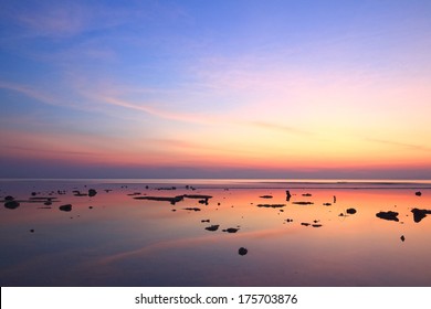 Sunset Sky Reflection Over Clear Sea 