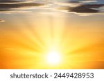 Sunset sky with sun light and sunset clouds background