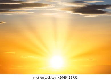 Sunset sky with sun light and sunset clouds background