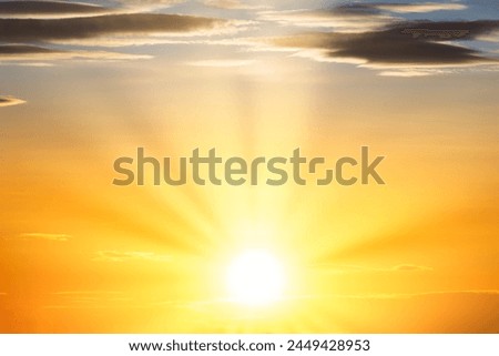 Sunset sky with sun light and sunset clouds background