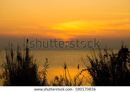 Similar – schöner Sonnenaufgang über dem See mit Pier und Yachten