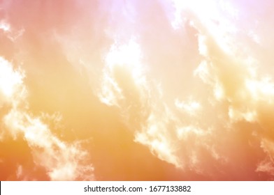 Sunset sky and sunrise orange bright abstract. Beautiful summer evening yellow clear cloud color day for wallpaper backdrop background.
