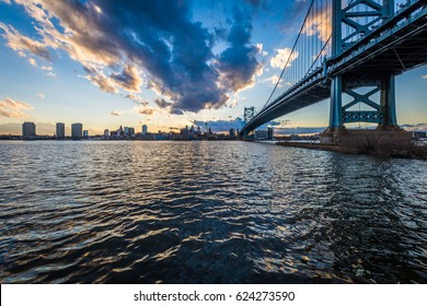 Sunset Skyline Of Philadelphia Pennsylvania From Camden New Jersey With Benjamin Franklin Bridge