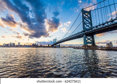 Sunset Skyline Of Philadelphia Pennsylvania From Camden New Jersey With Benjamin Franklin Bridge