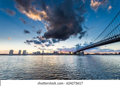 Sunset Skyline Of Philadelphia Pennsylvania From Camden New Jersey With Benjamin Franklin Bridge