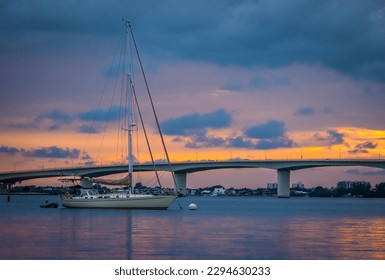 Sunset skyu behind the John Ringling Causeway Bridge over Sarasota Bay in Sarasota Florida USA