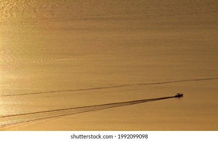 Sunset With A Small Boat On The Tapajós River, Brazilian Amazon