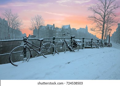 Sunset in snowy Amsterdam in the Netherlands in winter