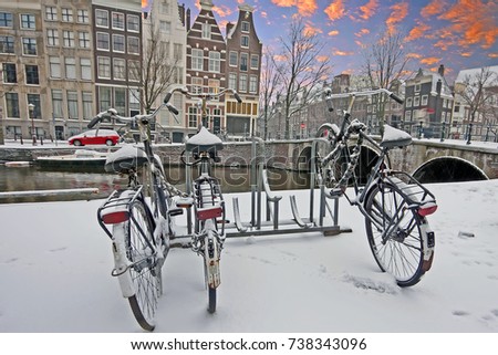 Sunset in snowy Amsterdam Netherlands in winter