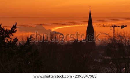 Sunset in the south of cologne with a view over the St. Aegidius church (Wahn) to Wesseling