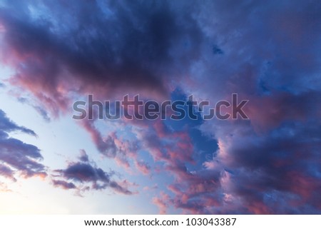Sunset with stormy sky and strange shaped clouds
