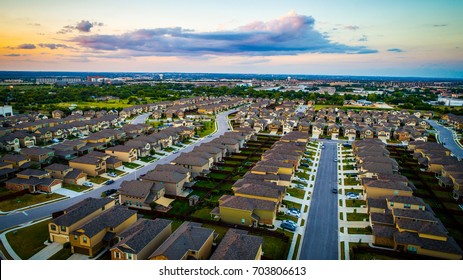 Sunset Suburb Rows Of Houses And Homes Line A Modern Neighborhood. Aerial Drone View Above Austin , Texas , USA Rooftops And Suburbia Layout 