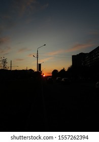a sunset in the suburbs
