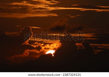 #sunset #sun hiding #clouds #golden hour #mesmerizing #sky