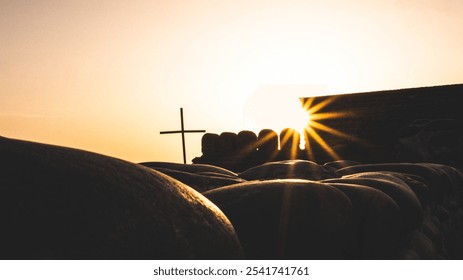 Sunset sun rays cross stone wall golden silhouettes - Powered by Shutterstock