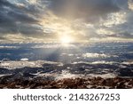 Sunset and Sun rays on Pikes Peak next to Colorado Springs