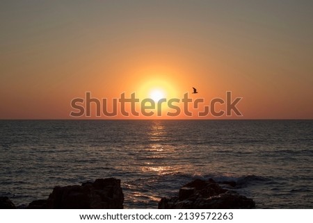 Sunset or sunrise over the Black sea near the town of Sozopol in Bulgaria. Natural gradient colors. Beautiful seascape from the shore.