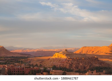 A sunset or sunrise view with dramatic light of old town Ait Benhaddou, Morocco a historic fortified village, noted for its ancient clay earthen architecture.