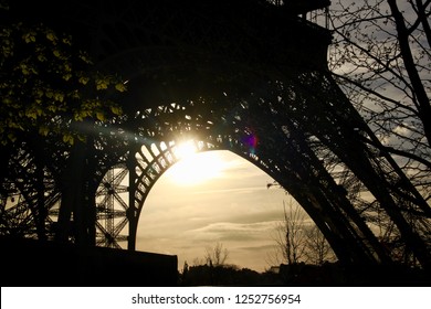 Sunset through the Eiffel Tower 