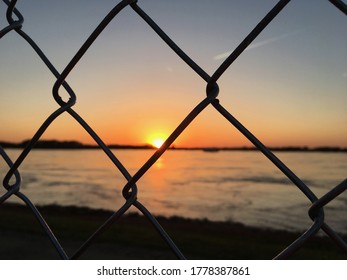 Sunset Through Fence At Tom Lee Park, Memphis, TN