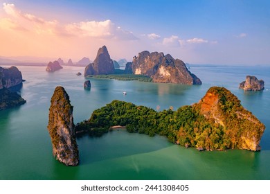 Sunset time Hong green lush tropical island and Phang Nga bay in turquoise sea, beautiful landscape of nature Thailand, drone aerial photo. - Powered by Shutterstock