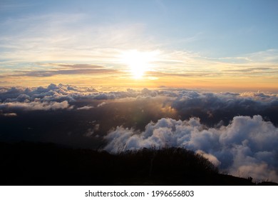 Sunset from the top of Mount Klabat at an altitude of 2100 meters above sea level with cloudy blue sky