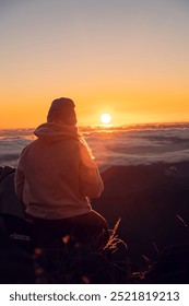 Sunset at the top with people in the background