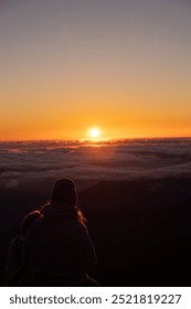 Sunset at the top with people in the background