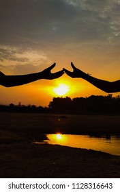 sunset under hands,sunlight 